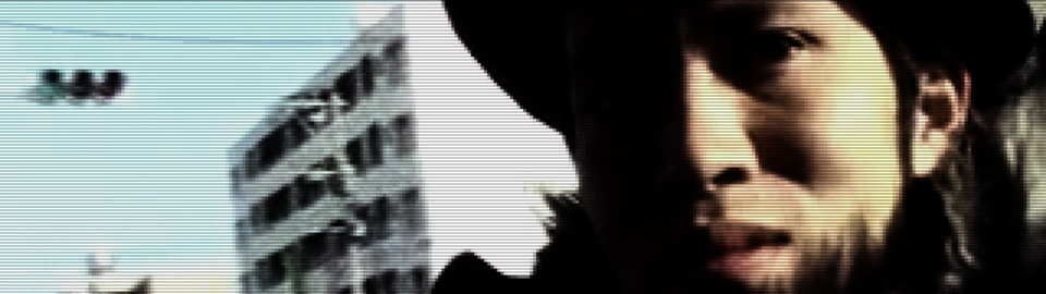 品田竜輔の顔のアップ 自主制作動画「おとこはつらいよ」の一場面 クリックすると動画が再生されます。